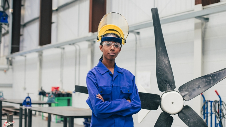Young Woman in an Engineering Workshop Young Woman in an Engineering Workshop